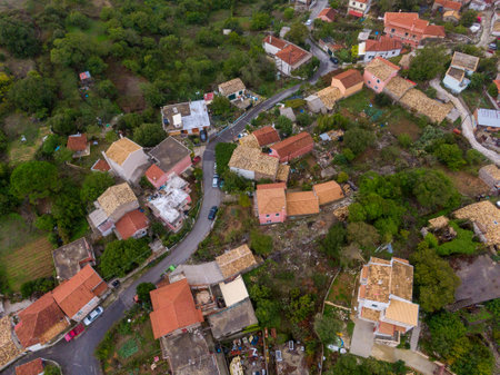 Aerial view of a charming village nestled in a hillside.の写真素材
