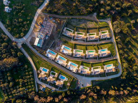 Aerial view of residential development with pools and landscaping.の写真素材