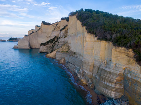 Majestic cliffs meet the vast blue sea.の写真素材