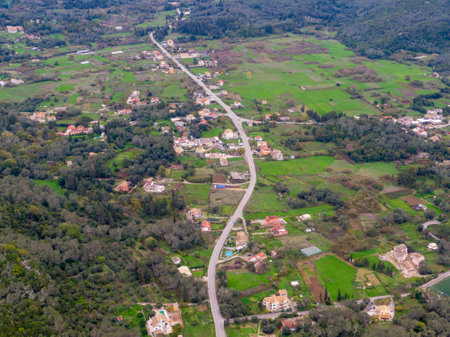 Aerial view of a winding road through a rural landscape.の写真素材