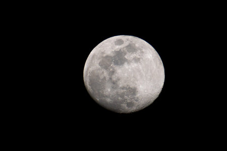 Lunar splendor on display, the moon's ethereal glow against the void of space is captivating.の写真素材