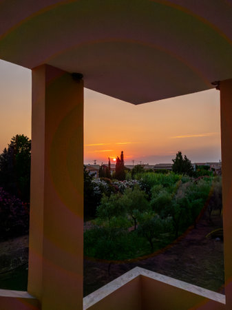 Scenic sunset view from a balcony, highlighting the vibrant colors and peaceful atmosphere of twilight.の写真素材