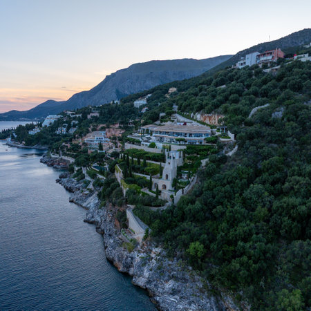 Coastal Estate: A stunning property perched atop a cliffside overlooking the sea, capturing serene views.の写真素材