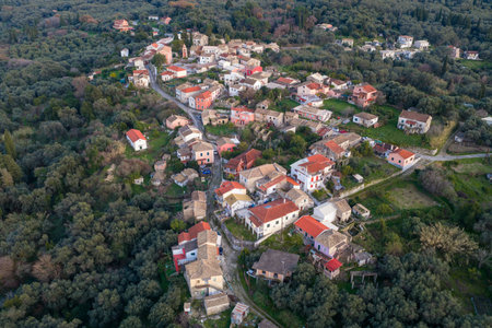 Scenic aerial landscape of Agioi Douloi village Corfu Greece with traditional houses scattered on a green hill slope surrounded by natureの写真素材