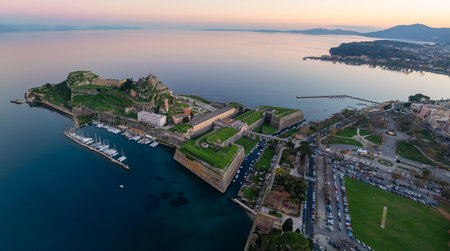 Aerial panoramic view Old Fortress Corfu Town, Greece, Ionian Sea, historic landmark, marina, architecture, sunset, vacation, travel, tourismの写真素材
