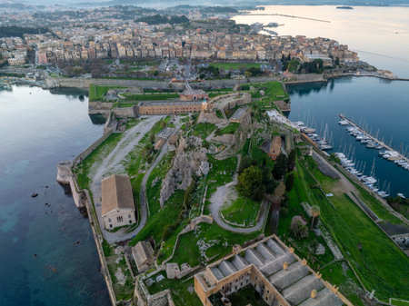 Aerial panoramic view of the Old Fortress and historic town of Corfu, Greece, with Ionian Sea and marina.の写真素材