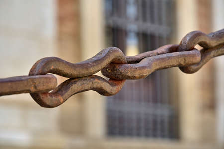 A chain with large iron links. Concept of union, resistance, strength, protection. Selective focus.の写真素材