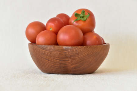 Red tomatoes in a bowlの写真素材