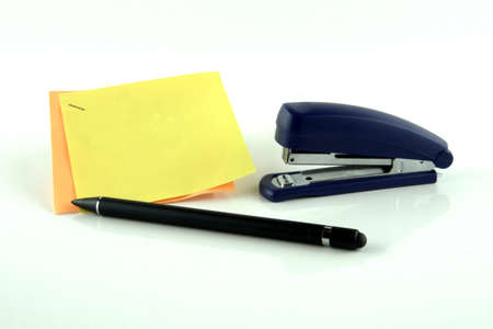 Pen with staples and notes with free space for your own text on white backgroundの写真素材