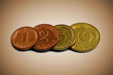 Close up of four old german coins on a sepia backgroundの写真素材