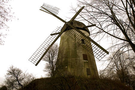 Old dilapidated windmill on the verge of demolitionの写真素材