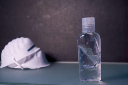 Gel sanitizer bottle and pair of masksの写真素材