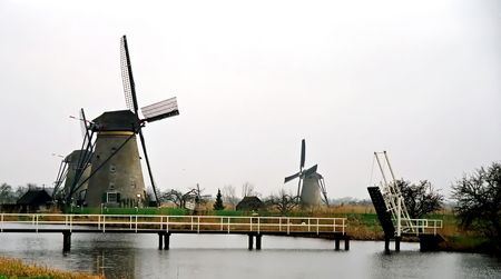 Photo of the windmill's situated on the rivers bank.