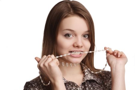 Image of the teen girl with beads in teethの写真素材