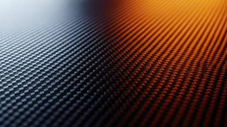 This image presents a close-up of a carbon fiber texture, showcasing a pattern of small squares. The scene is split diagonally with blue and orange lighting, creating contrast. The composition highlights geometric precision, and could be utilized for various commercial and design purposes.の素材