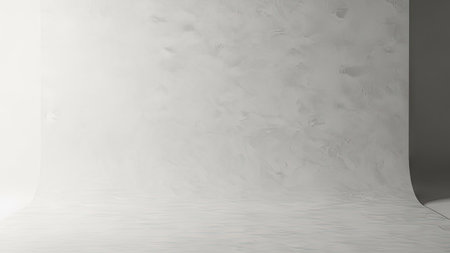 A neutral-toned studio backdrop presents a minimalist aesthetic. The smooth texture creates soft shadows and a gradient effect. Suitable for product photography, graphic design elements, or website backgrounds. The lighting enhances the simplicity, making it ideal for various commercial and editorial projects.の素材