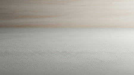 An abstract composition presents a minimalist design featuring two distinct textured surfaces. The upper section displays a warm, neutral tone, while the lower area has a cooler, lighter color. The lighting is soft and diffused. This image might be suitable for various design projects, marketing materials, or website backgrounds.の素材