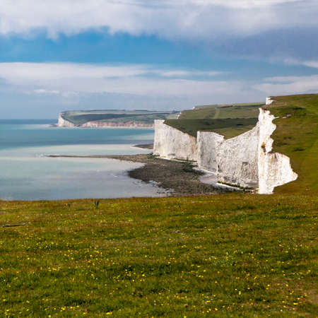 The Seven Sisters chalk cliffs between Seaford and Eastbourne. East Sussex. England. Viewed from Hope Gapの写真素材