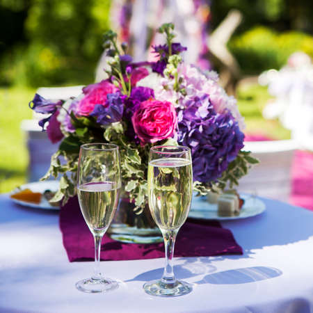 bridal bouquet and two glasses of champagne.の写真素材