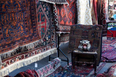 London - January 17, 2015. Flea market with old-fashioned goods displayed in London city, UK. On 17 January 2015. Messy packed room full of antique objects like chair, glasses, carpetのeditorial素材