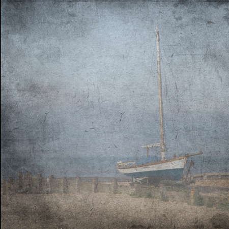 Textured old grange paper background with blue sail yacht near the seaの写真素材