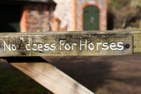 wooden Sign "No access for horses" in English villageの写真素材