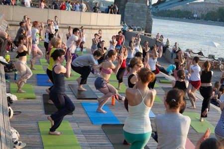 MOSCOW - JUNE 21: People participating in the free public Yoga class in summer at Park,  on June 21, 2015 in Moscowのeditorial素材