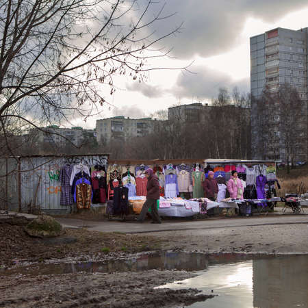 Moscow, RUSSIA - October 26, 2015: Street market. Two saleswomen sell clothesのeditorial素材