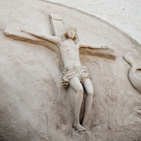 GUARDAMAR DEL SEGURA, SPAIN - JULY 3, 2013: Guardamar is a municipality of the province of Alicante located at the mouth of the river Segura in southern Valencia, Spain. Sand's figure of Jesus Christ at the beachのeditorial素材
