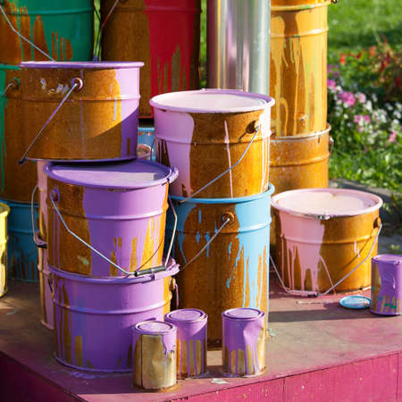 Paint cans on different colorsの写真素材