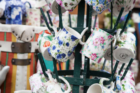 LONDON-SEPTEMBER 27:Spitalfields Antic Market September 27,2008 in London. Market is fourth most popular attraction in city attracting over 100,000 people each weekend. Red vintage dressのeditorial素材