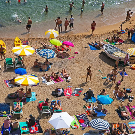 SPAIN - JULY 12, 2015: Tossa Beach is famous destination in Spain. Located in Tossa de Mar, Catalonia on the shore of Balearic Sea in Costa Brava region, place is distanced 105 km north of Barcelonaのeditorial素材