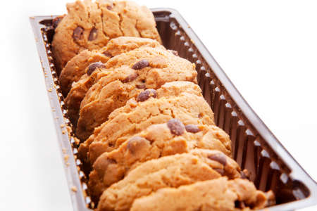 Plastic box filled with cookies isolated