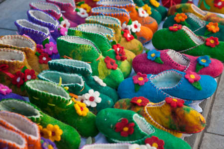 TBILISI, GEORGIA - November 04, 2016 : Handmade colorful wool slippers or shoes for sale at street...