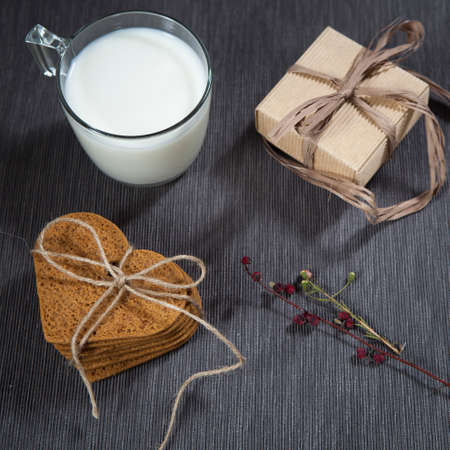 Gift for Valentine's Day. Gingerbread heart-shaped,  gift packaged in a corrugated box for a loved one.の写真素材