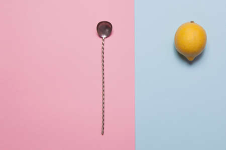 the Fresh lemon and dried orange slices on a blue and pink background. greeting cardの写真素材