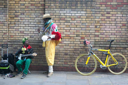 London, England, UK - August 4, 2016: Performers busking at Brick lane on Sunday