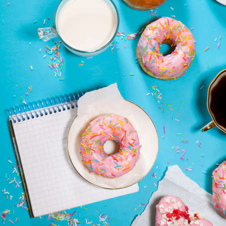 The ideal breakfast for the proper energy for the full day. Fresh coffee with milks and donuts . Hipster pictures. Top viewの写真素材