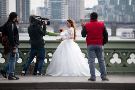 London, UK Thursday March 23, 2017 The bride is giving an interview on the bridge near Westminster. After the terrorist attack.のeditorial素材