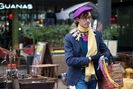 London, UK Thursday March 23, 2017   Brightly dressed man  in typical East London style on Brick Lane. Street fashion.のeditorial素材