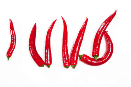 Red chili peppers isolated on white background. Postcards for recipesの写真素材