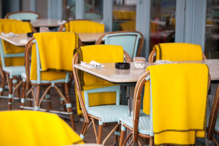 Restaurant zone with colorful plastic chairs and tables and yellow plaid in the lobby of the mall. Beautiful interiorの写真素材