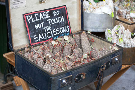 LONDON, ENGLAND - August 25 , 2017. Spanish Meat Products and Sausages in suitcase for sale on Borough Marketのeditorial素材
