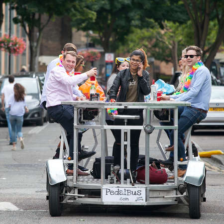 LONDON, ENGLAND - August 11 2017 Happy friends celebrate the wedding, pedal the pedalbus, drink beerのeditorial素材