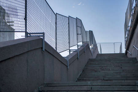The staircase leading to the bridge at duskの写真素材