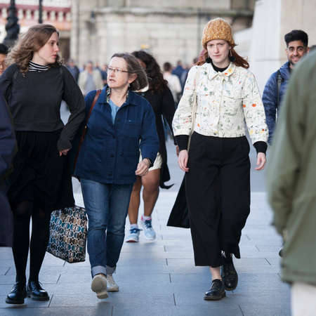 LONDON, ENGLAND - September 11, 2017 Fashionably dressed women walk along the River Thamesのeditorial素材