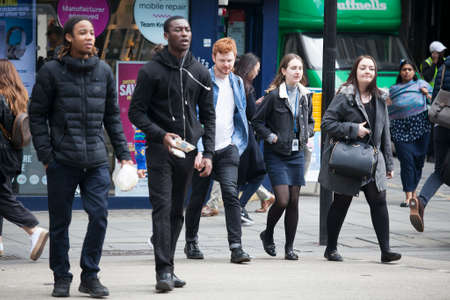 LONDON, ENGLAND - September 11, 2017 People cross the road in the Oxford Street area