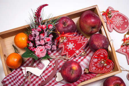 Christmas decoration on the white wooden vintage background. New year greeting card template. Holiday mock up. Scandinavian style.の写真素材