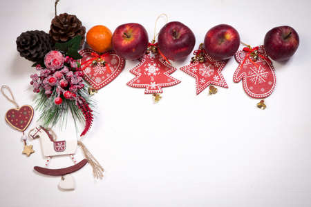 Christmas decoration on the white wooden vintage background. New year greeting card template. Holiday mock up. Scandinavian style.の写真素材