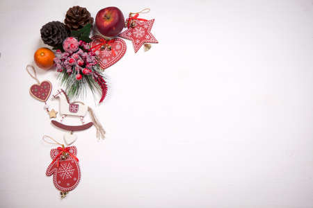 Christmas decoration on the white wooden vintage background. New year greeting card template. Holiday mock up. Scandinavian style.の写真素材